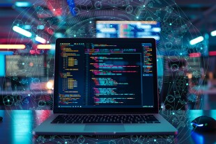 software codes display on screen of a laptop on the table in mod