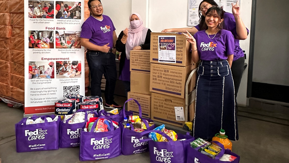IMG_Staff from FedEx Express Malaysia are pictured with some of the packaged food and essential items collected.png