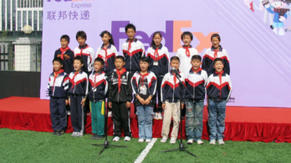 migrant-children-sing-at-fedex-family-day.jpg