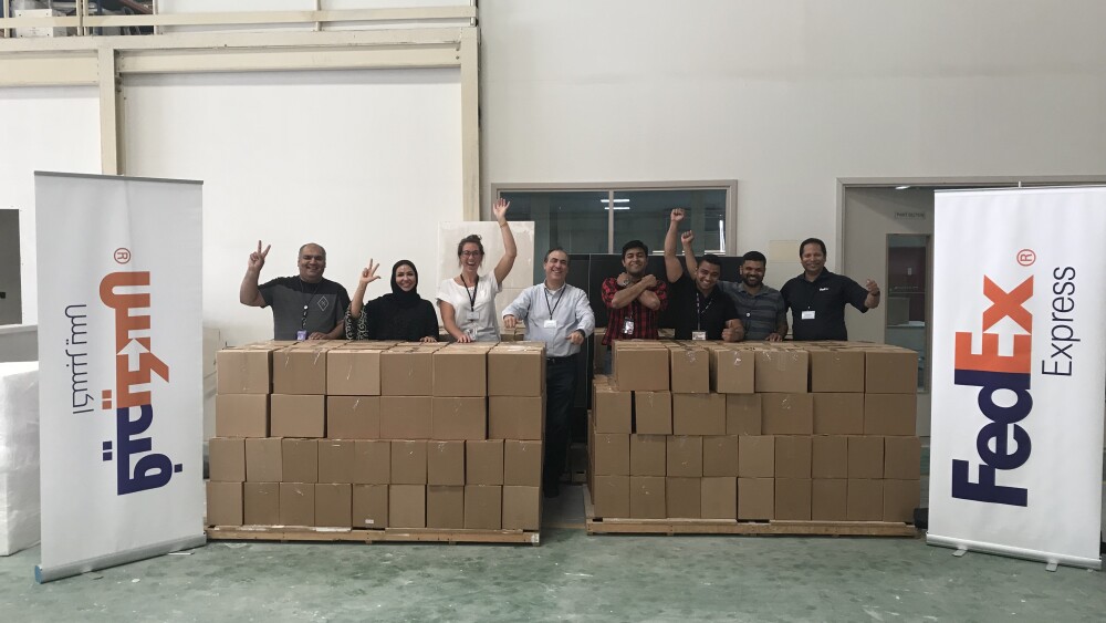 fedex-team-members-volunteering-and-providing-food-supplies-to-members-of-the-uae-society.jpg