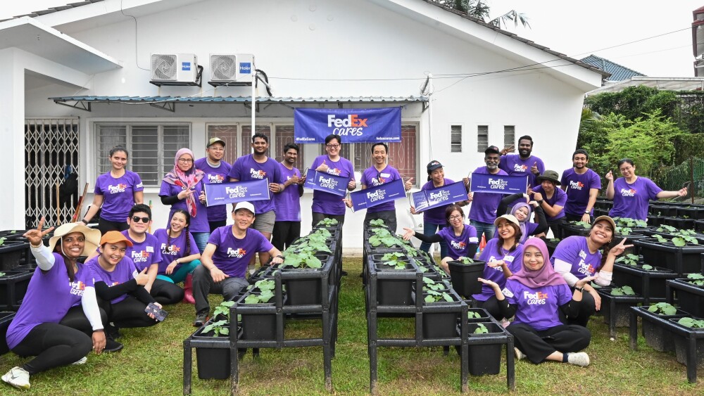 FedEx team members engaged in a community vegetable program to help disadvantaged communities in urban areas.jpg
