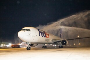 A water salute ceremony was held to welcome the first FedEx Boeing 767 Freighter that was used to kick start the new flight in the evening of October 31, 2023.jpg